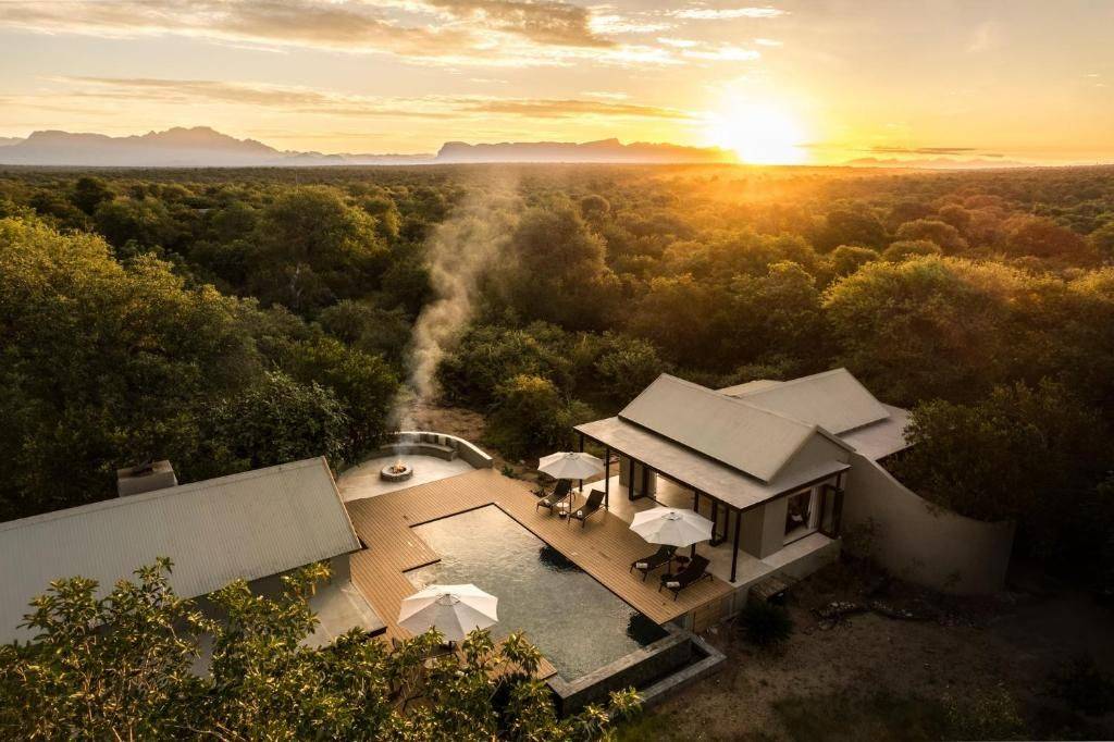 Ujima lodge at sunrise above the bush